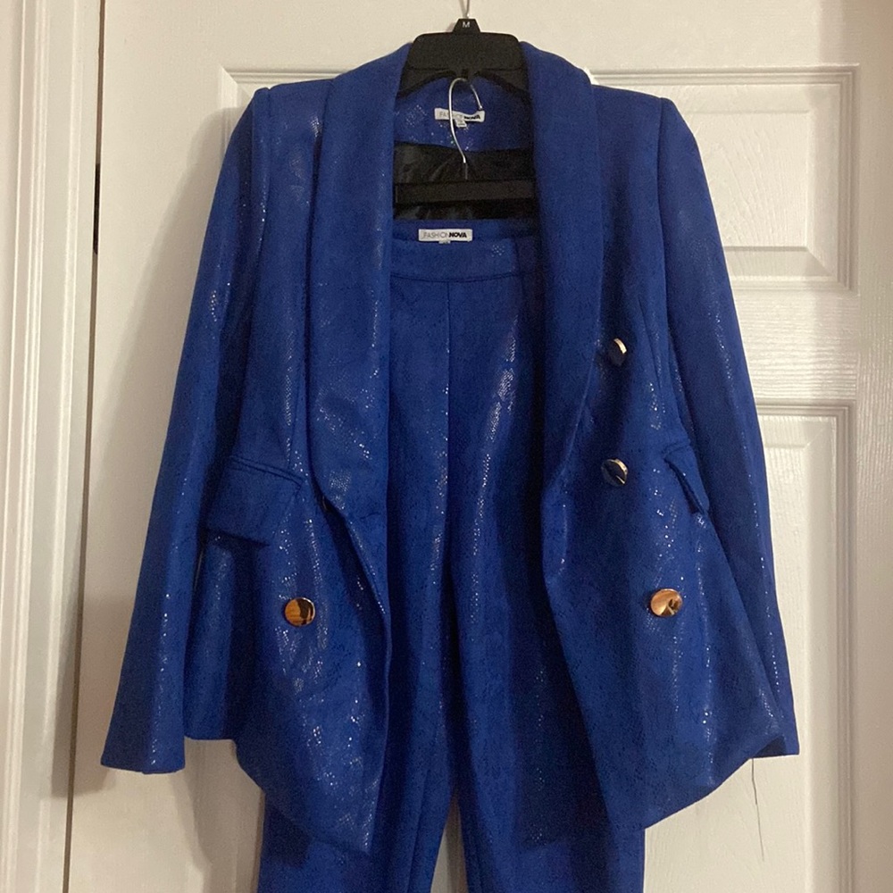 Blue pant suit. Snake skin design.